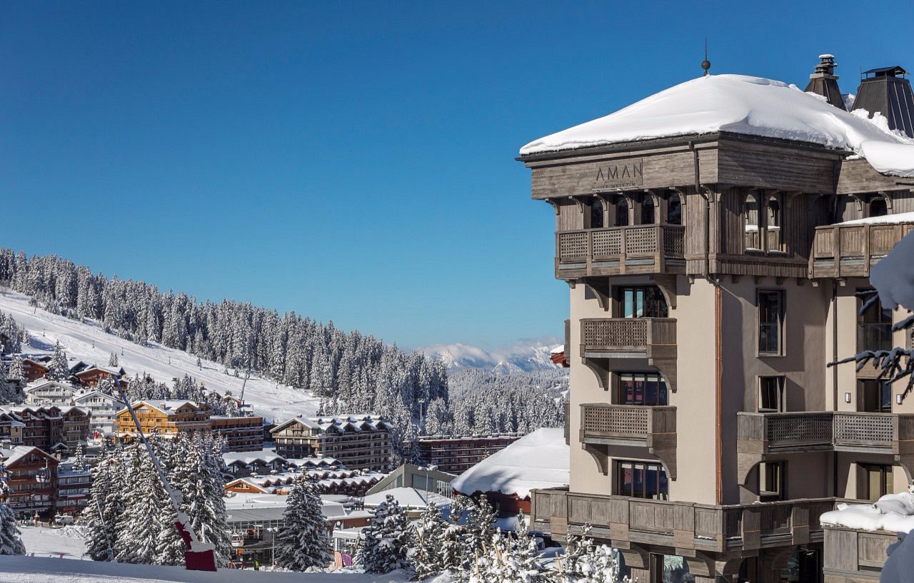 Aman Le Mélézin in Courchevel, France, a luxury alpine chateau surrounded by snow-covered mountains