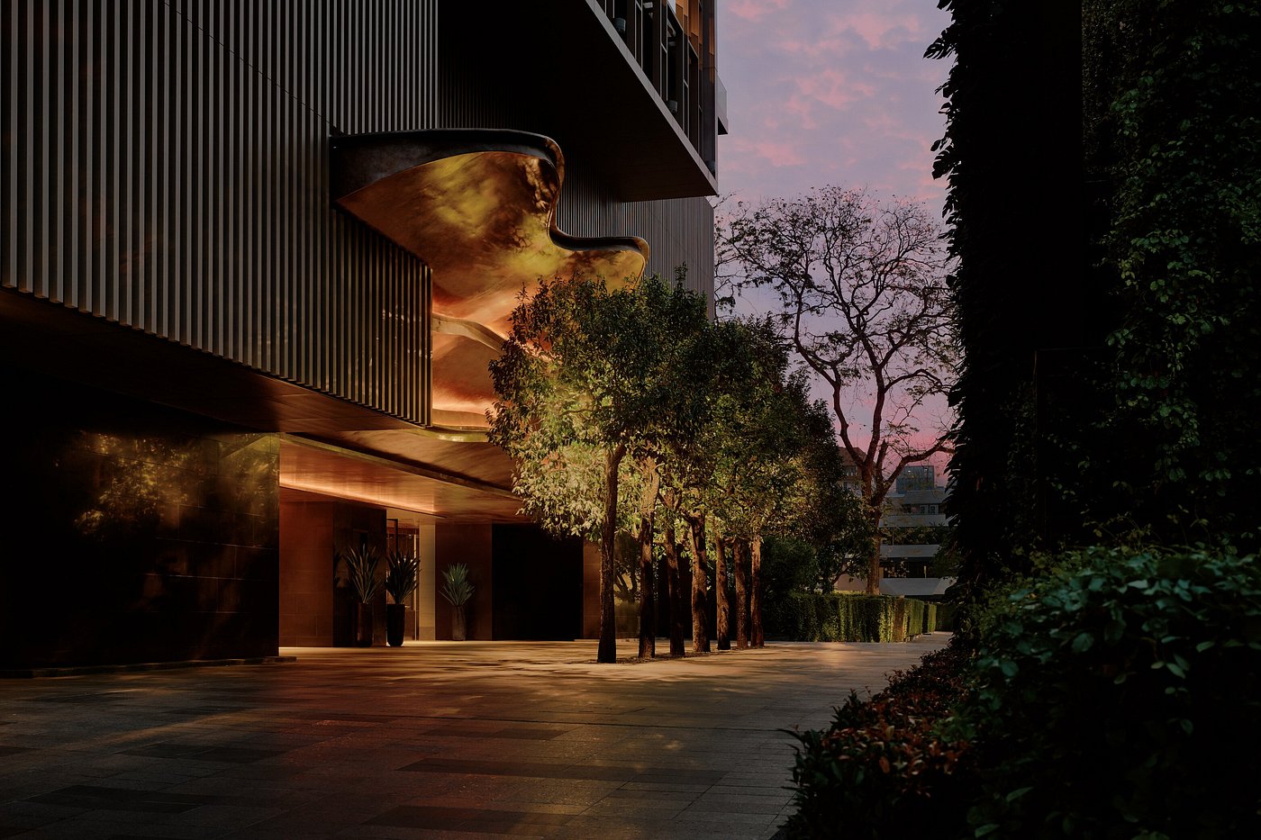 Aman Nai Lert Bangkok nestled within lush greenery in the heart of the city, blending modern luxury architecture with serene garden surroundings