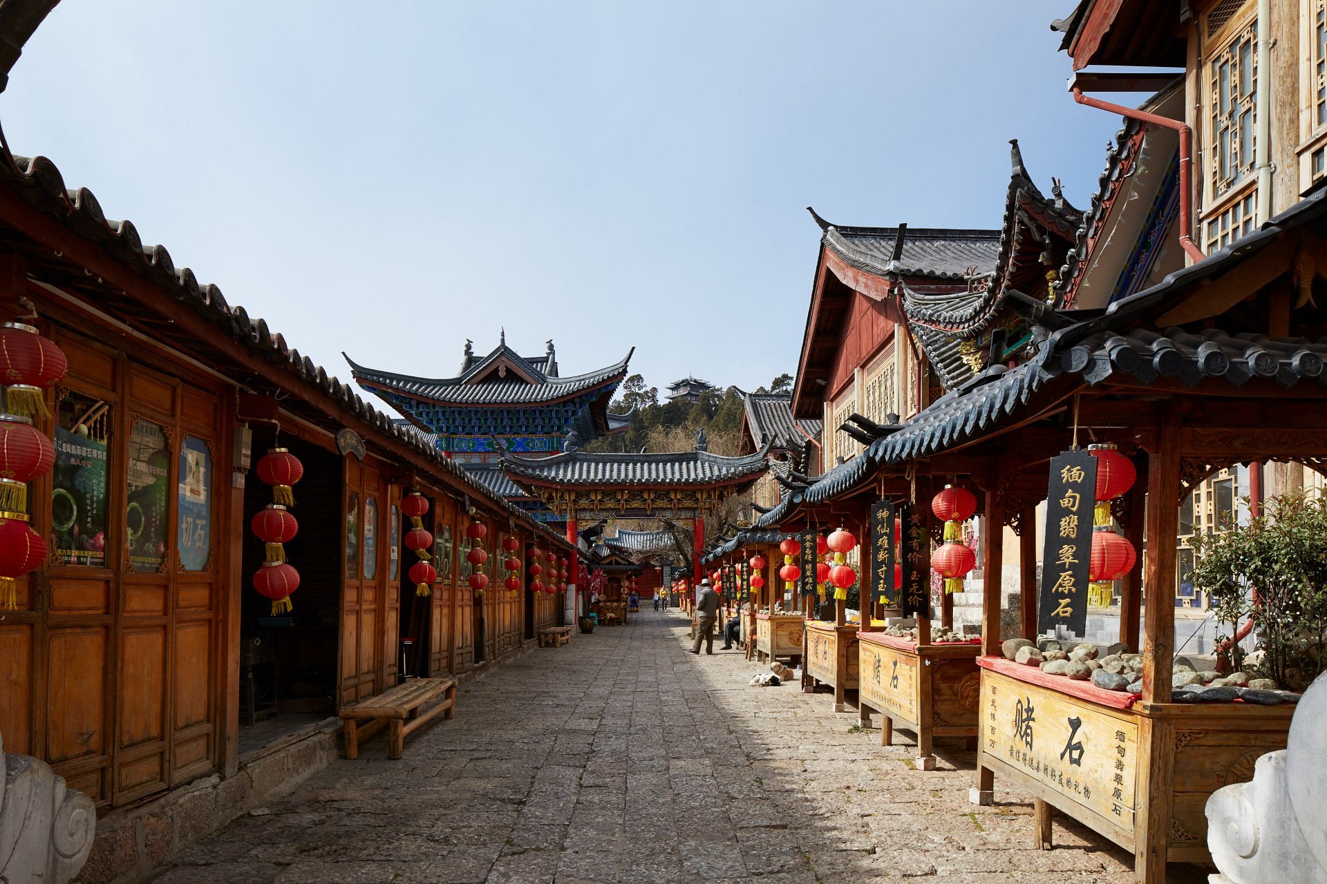 Amandayan hotel in Lijiang, China featuring traditional Naxi-inspired architecture overlooking panoramic mountain landscapes at sunset