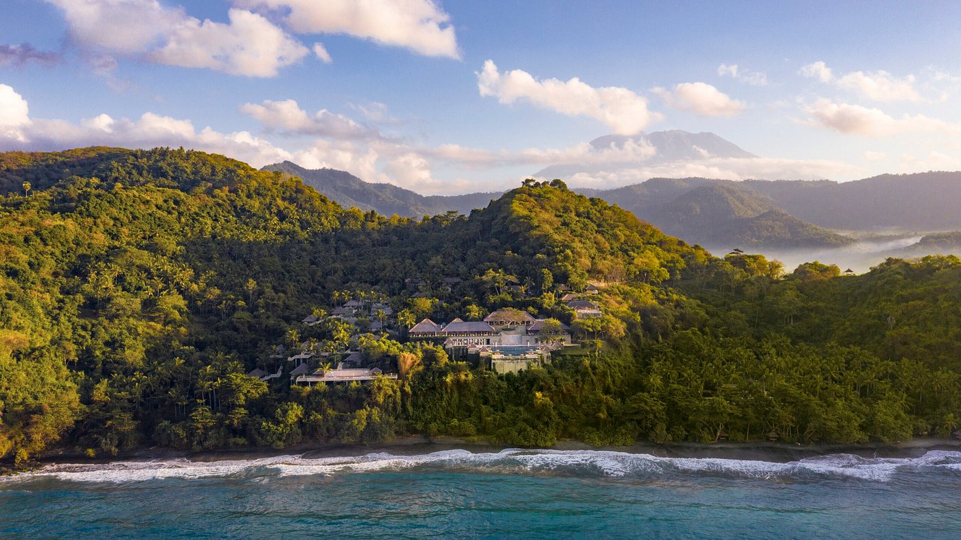 Amankila luxury resort overlooking the ocean in Bali, Indonesia with terraced infinity pools and lush tropical surroundings